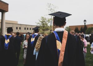 back image of student in graduation gown